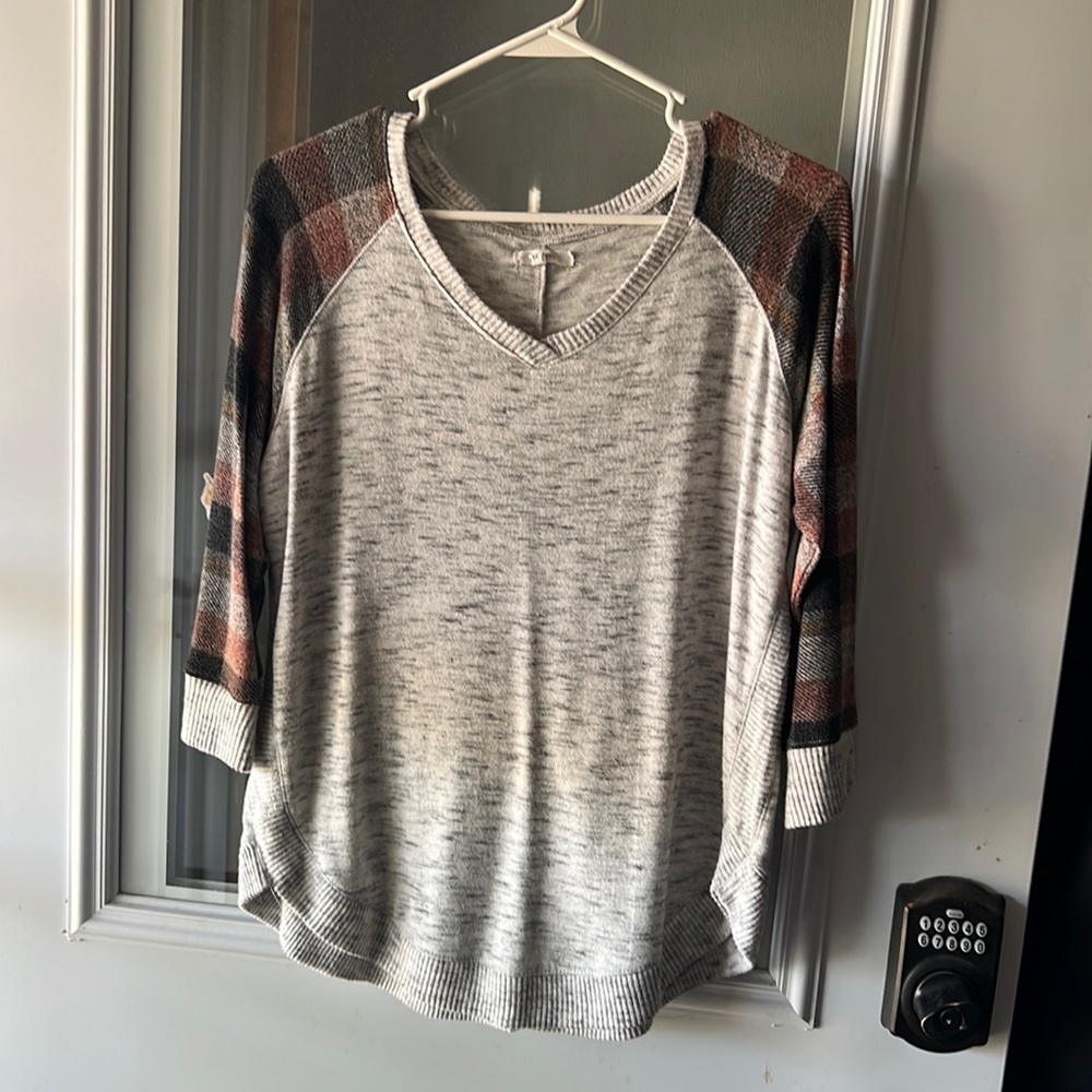 Gray sweater with plaid sleeves. Great condition.